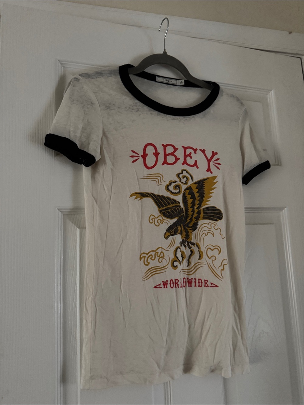 Obey White Tee with Black Trim and Red & Gold Graphic - Womens